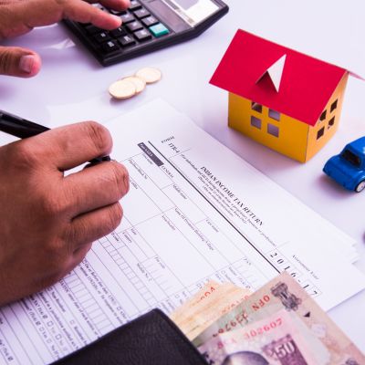 different taxes buyer pay on property purchase from NRI or others