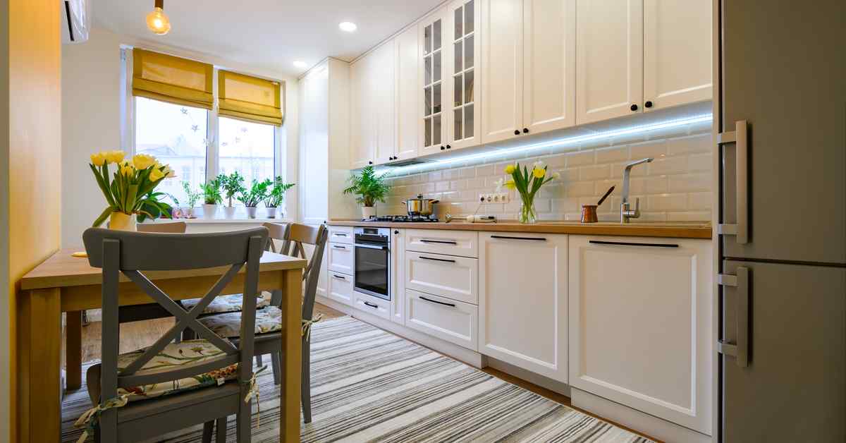 House & Home - Brass Cabinets & A Clever Mix Of Materials Stun In This  Condo Kitchen