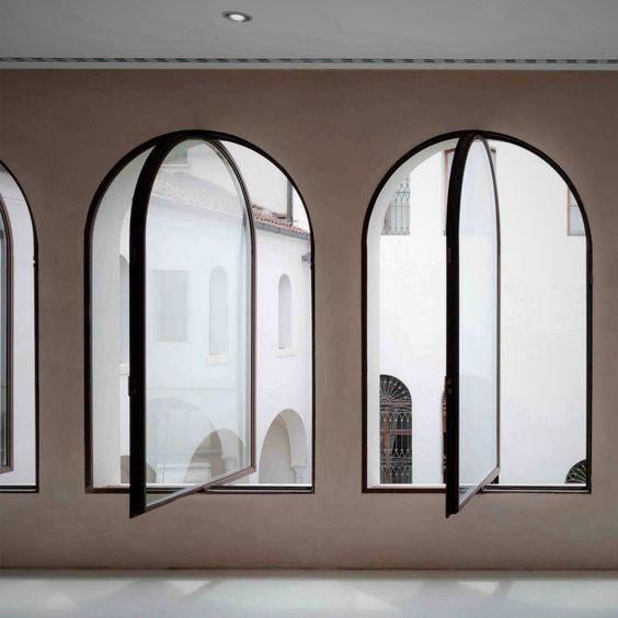 Arch window designs have been used in Indian homes for centuries and still remains a popular choice!