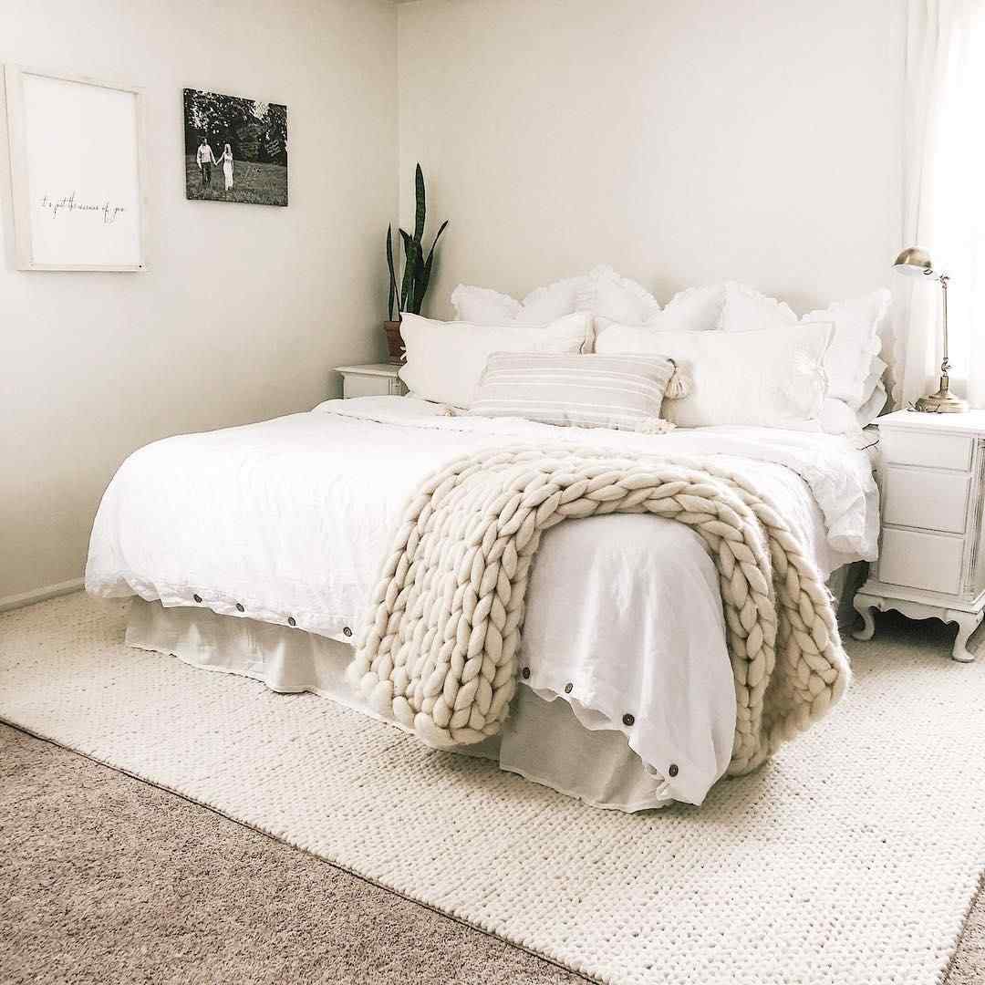 Bedroom with white rug