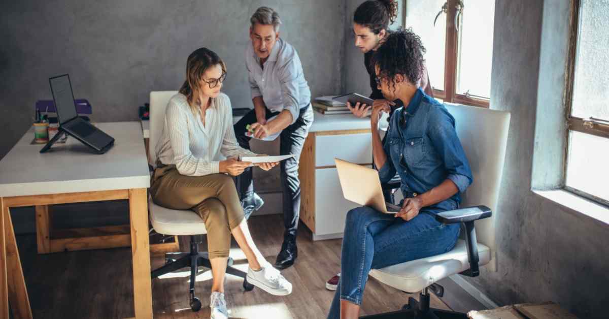 diverse-group-of-business-people-working-together-at-a-small-office