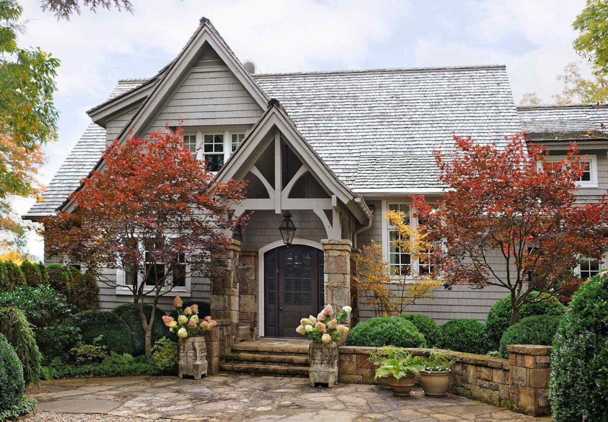 gray-house-with-stone-entryway-modern-farmhouse-home-exterior-design